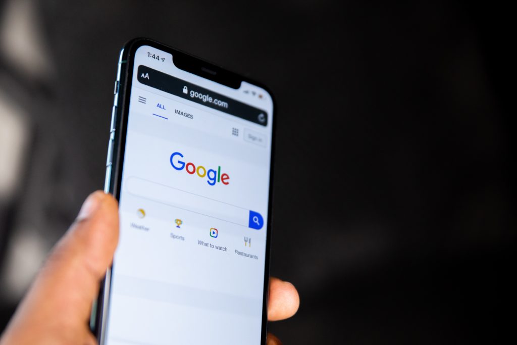 hand-holding-a-phone-with-google-search-on-the-screen